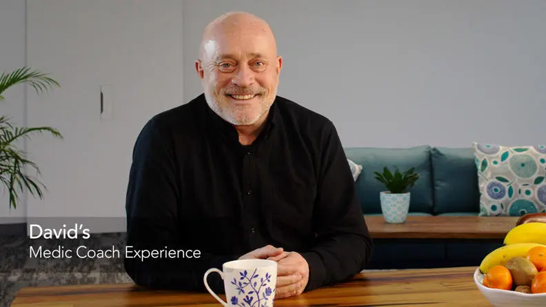 Image of david in this living room smiling at the camera