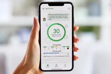 Image of a hand holding onto a phone with the app displaying on the screen